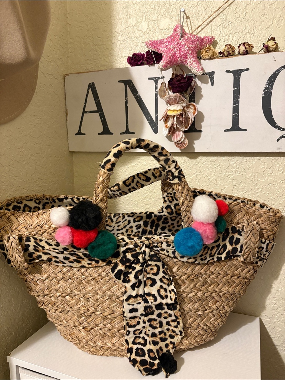 Leopard-Trim Straw Tote with Colorful Pom-Poms - resort vacation bag
